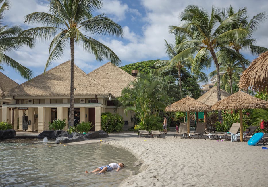 Serene beach resort with palm trees and sandy shore, ideal for relaxation and leisure.